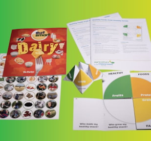 Healthy Foods From Healthy Farms materials spread on black background, including fortune teller and folding plate activity sheets